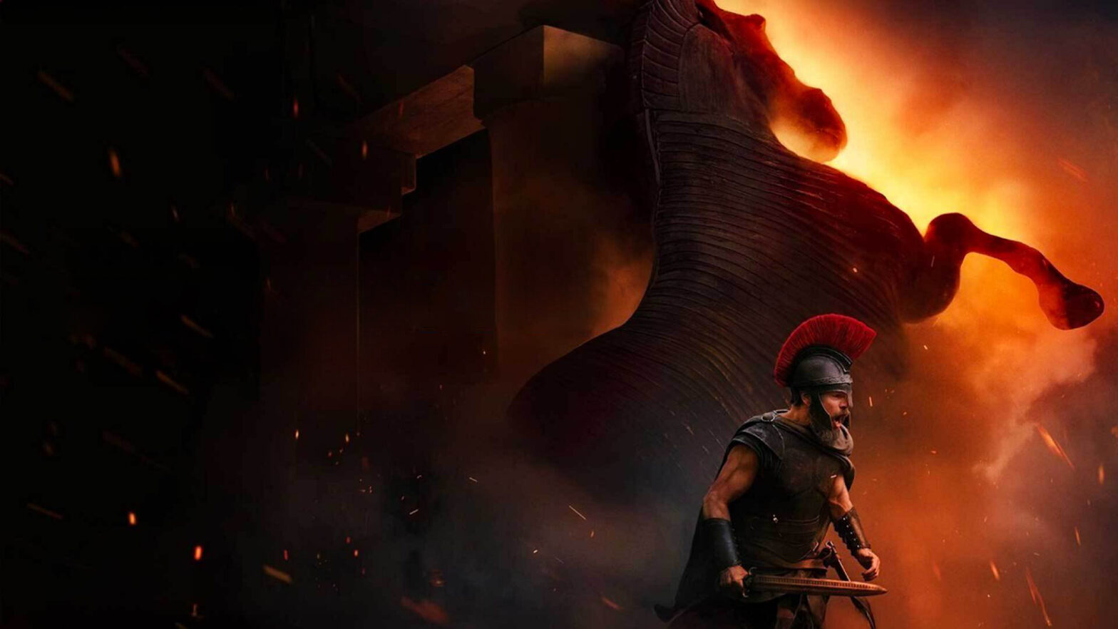 Armored warrior with a red crest stands in a fiery, smoky scene with a massive dark figure looming behind him.