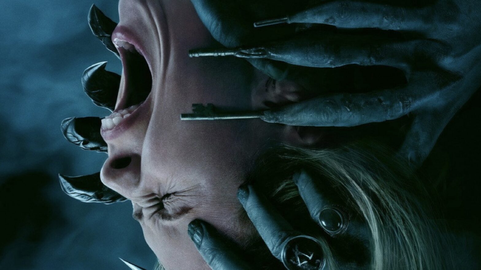 Close-up of a person with mouth wide open in a scream as gloved hands press on their jaw with small metal tools in a dark, blue-tinted scene.